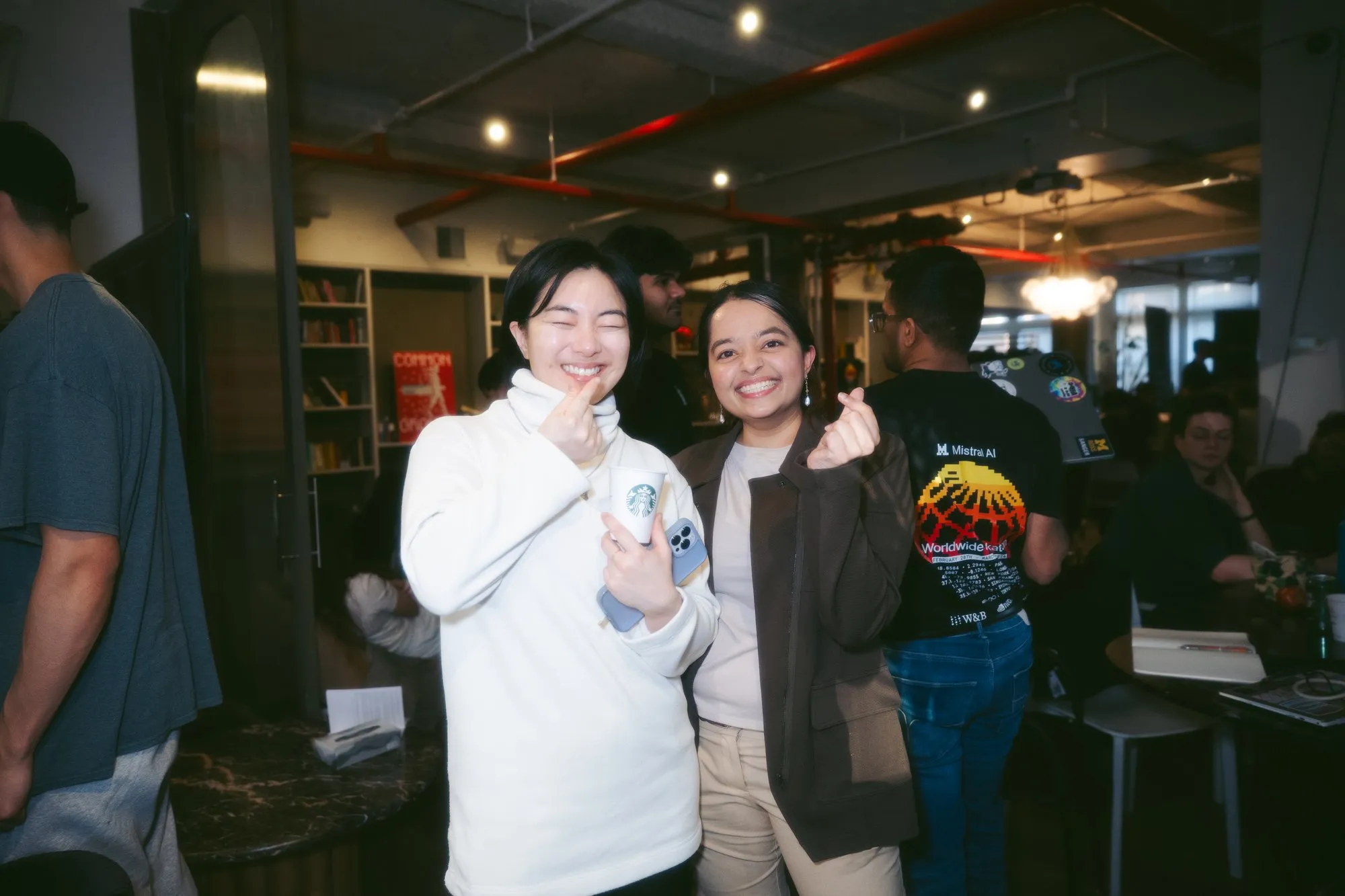 Two women smiling at venue