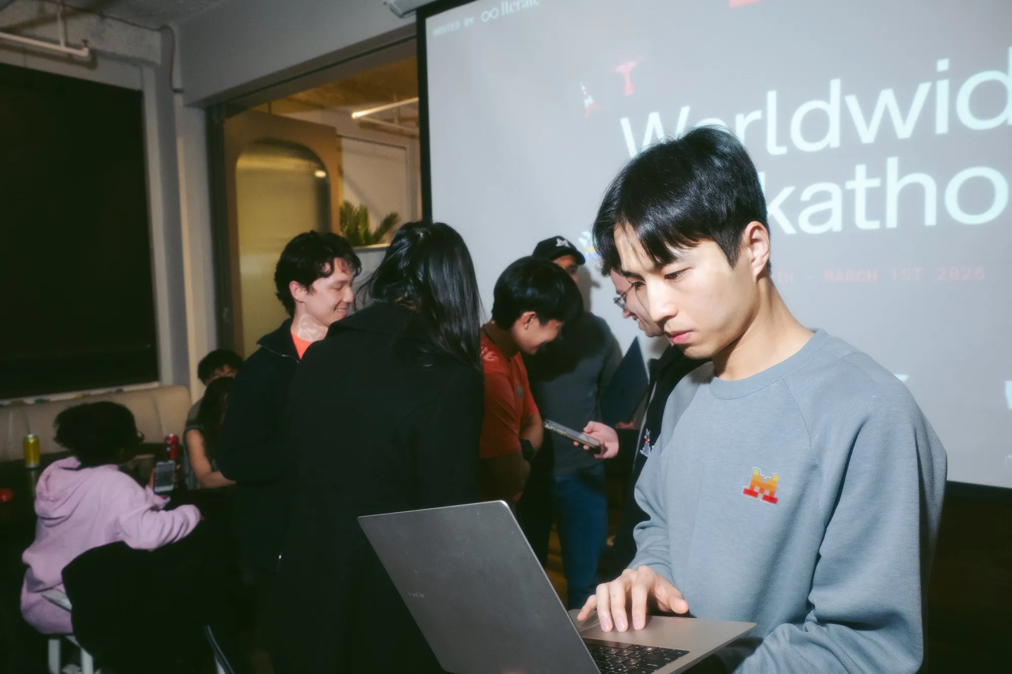 Builder standing at laptop