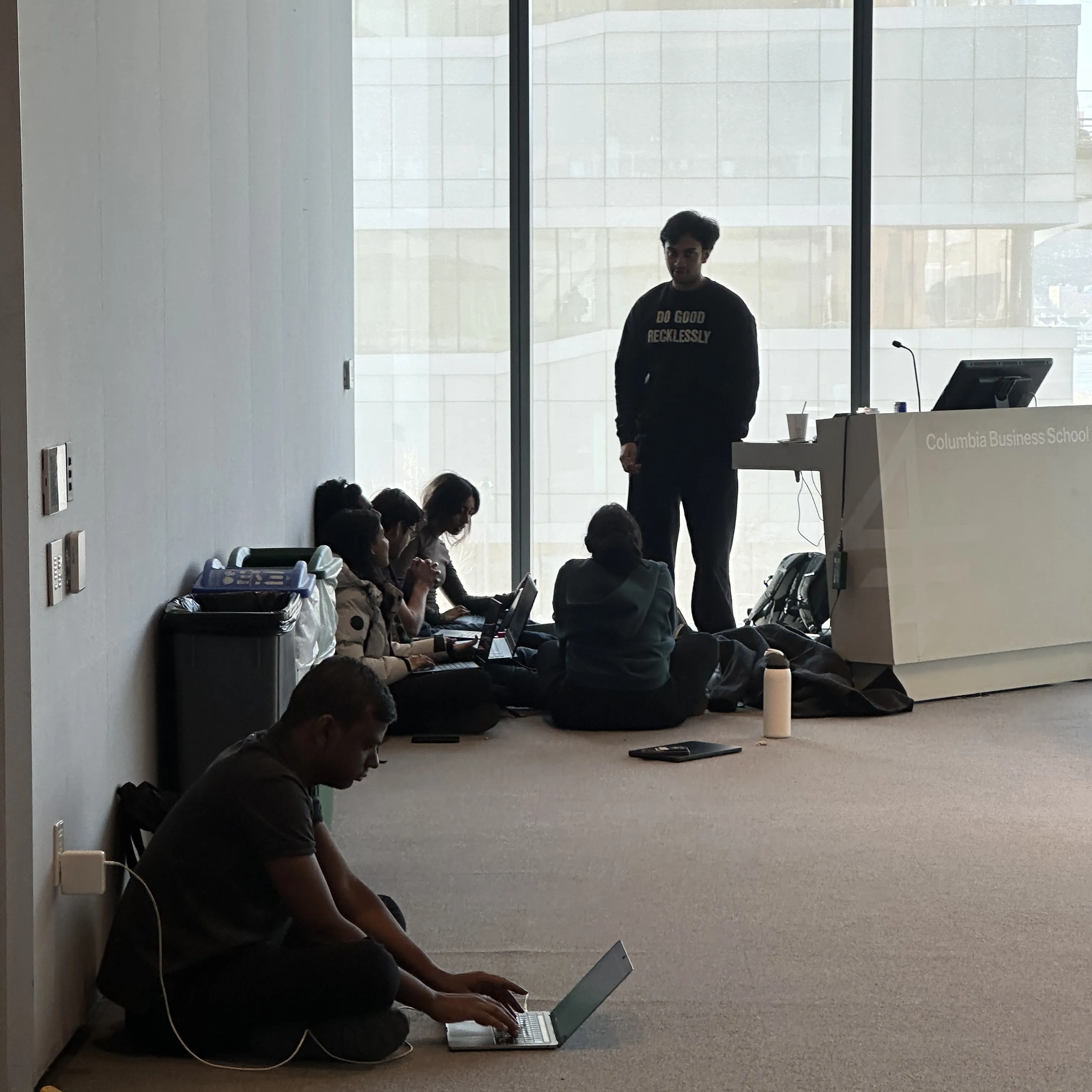 Focused team coding around desk