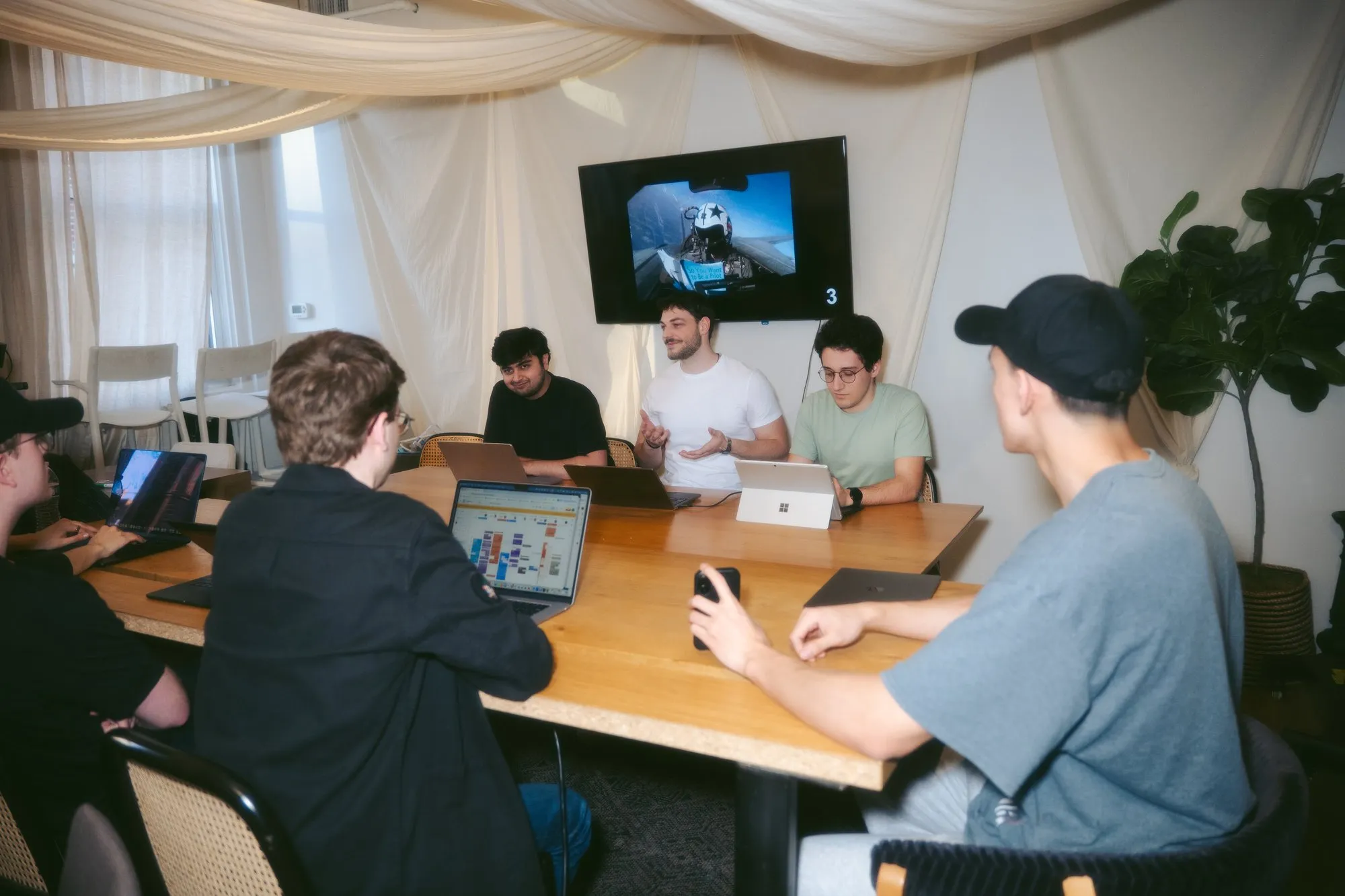 Team presenting demo on screen