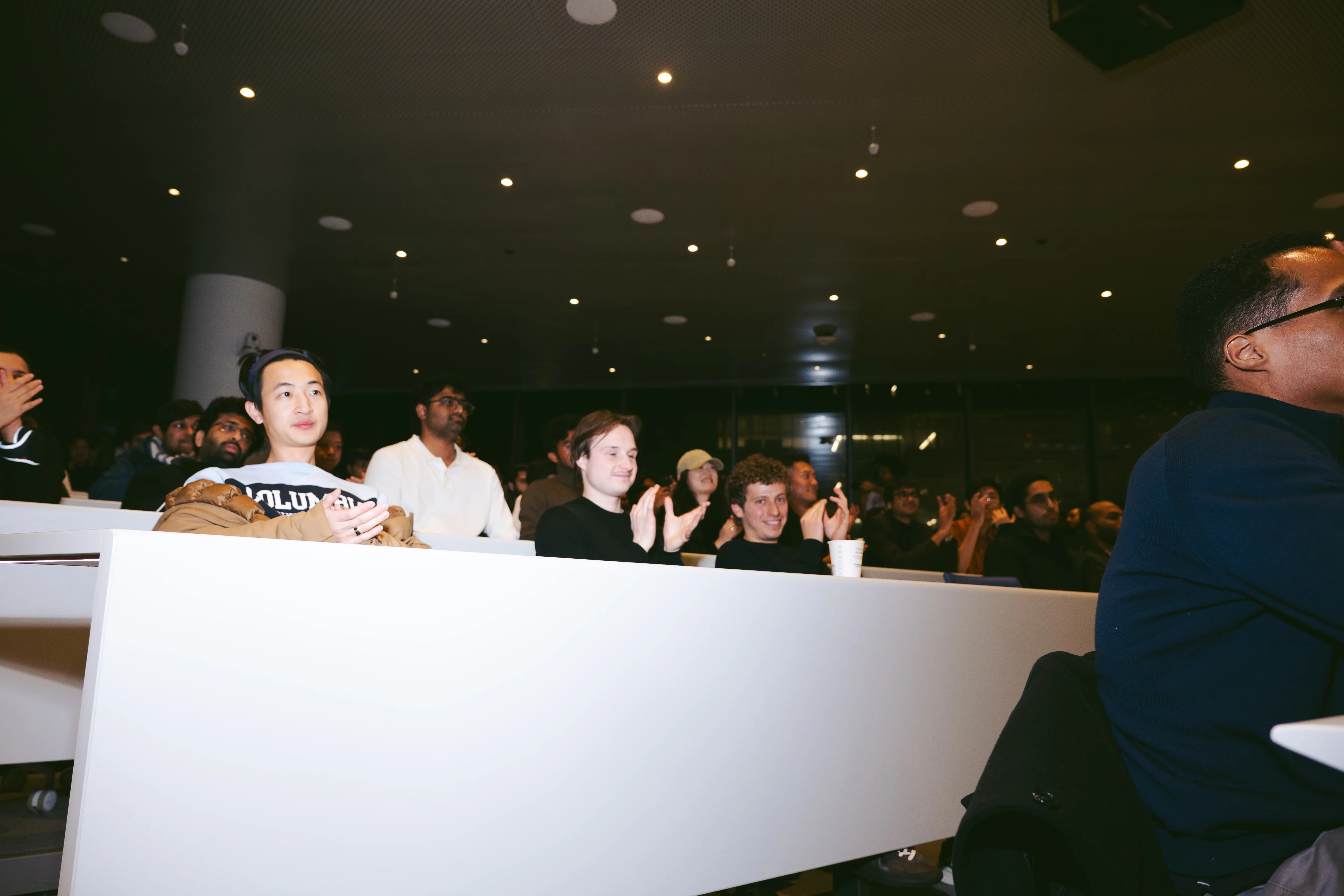 Audience applauding the pitch presentations
