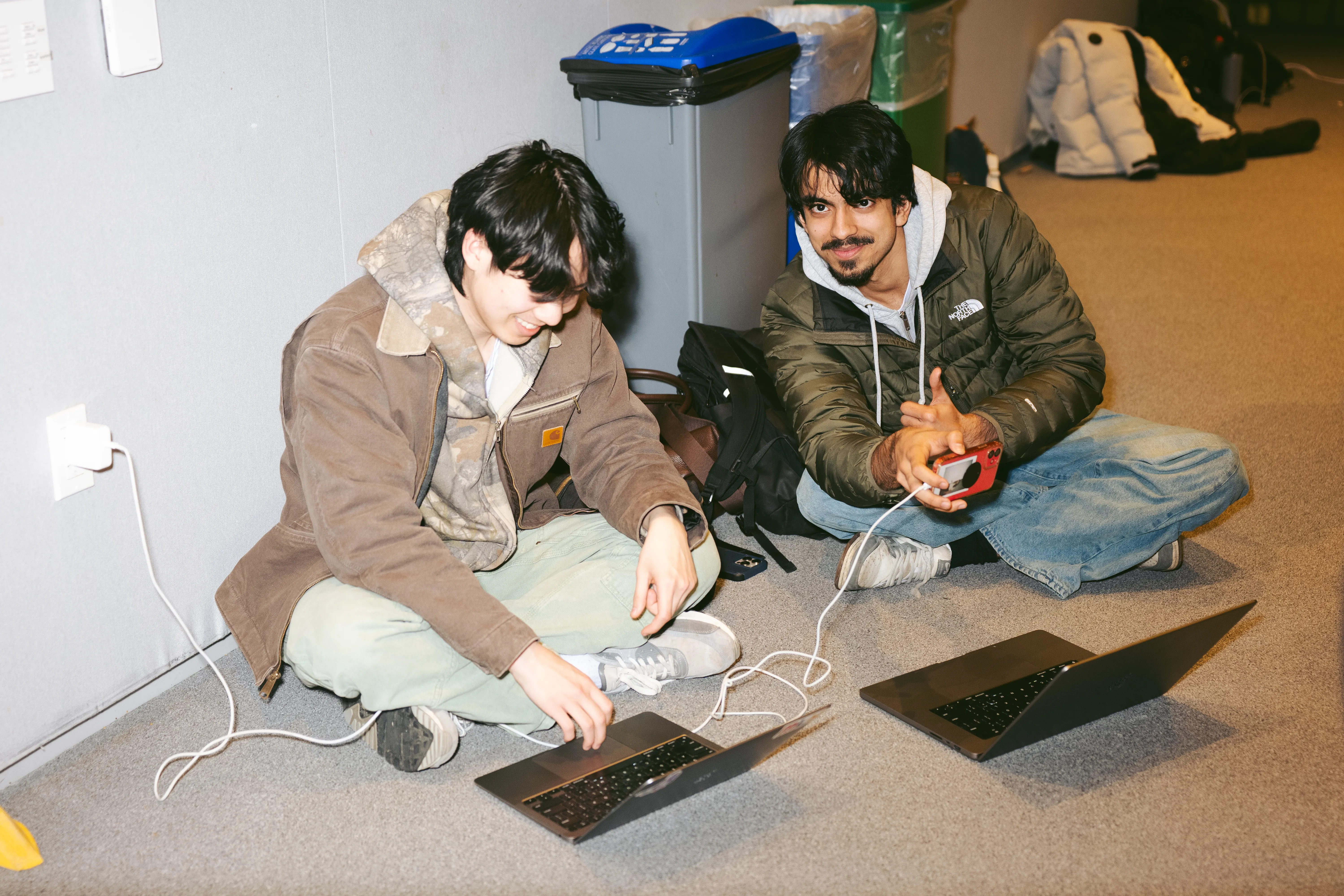 Builders debugging together in lounge